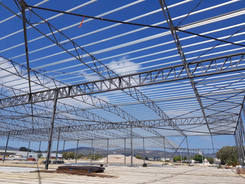 Steel framework with Stramit purlins against a blue sky